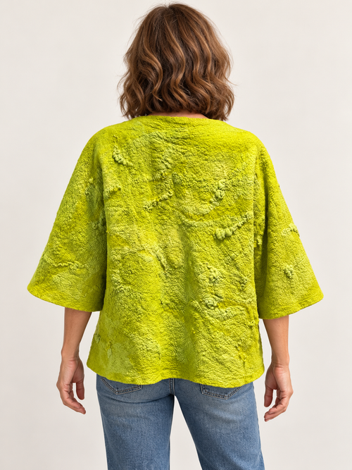 Back view of chartreuse textured jacket with wide three-quarter sleeves