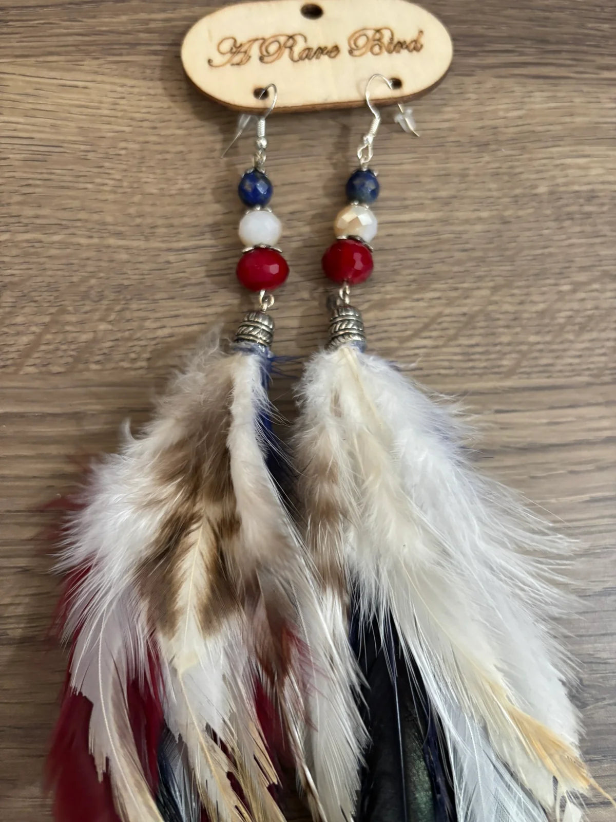 A Rare Bird Feather Red, White & Soar Feather Earrings